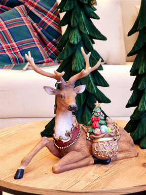 Rena decorativa com saco de presentes