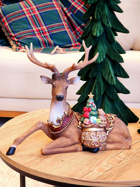 Rena decorativa com saco de presentes